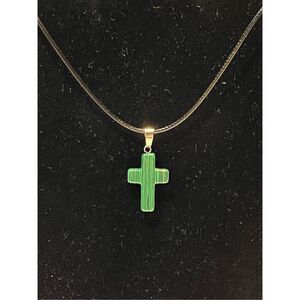Green Stone Cross on a Black Necklace Cord